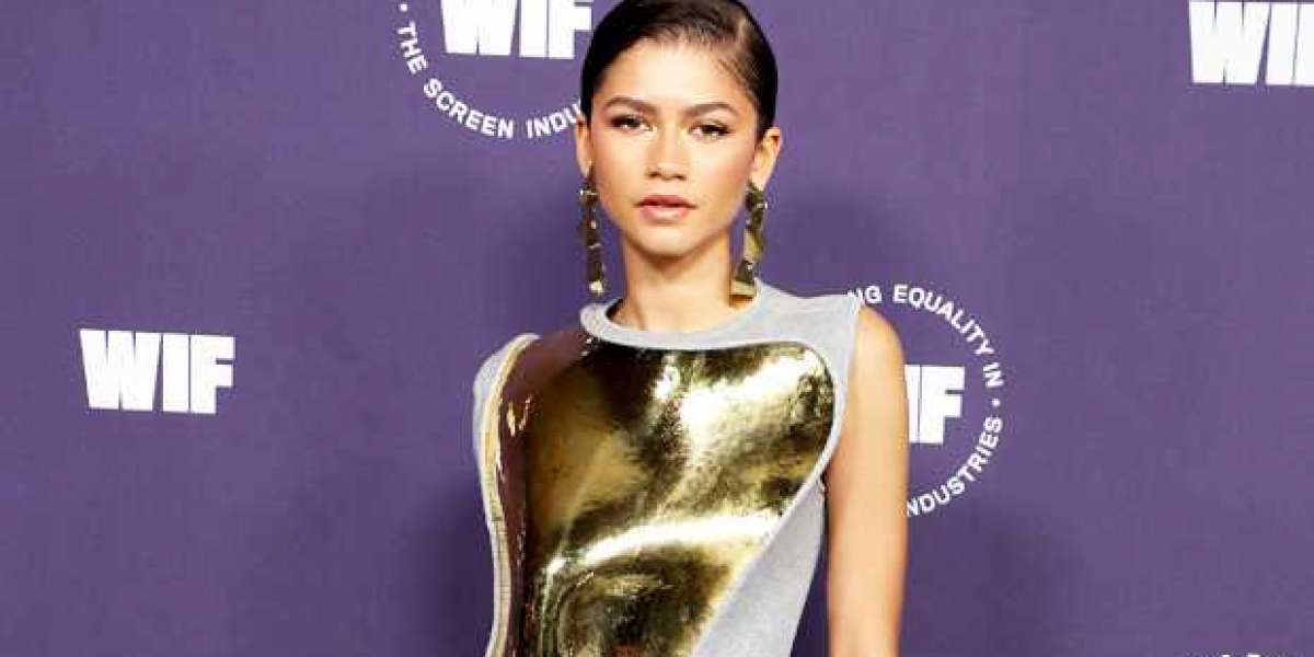 Zendaya walked the red carpet wearing a gold breastplate 